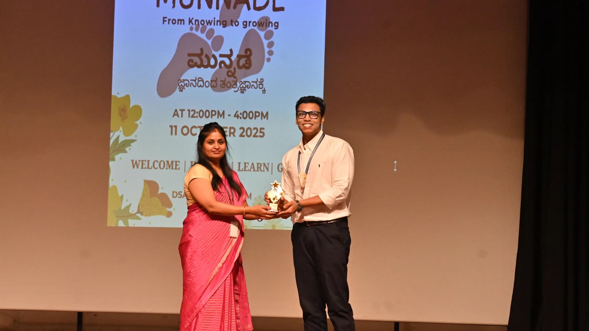Arnav receiving his award at his college