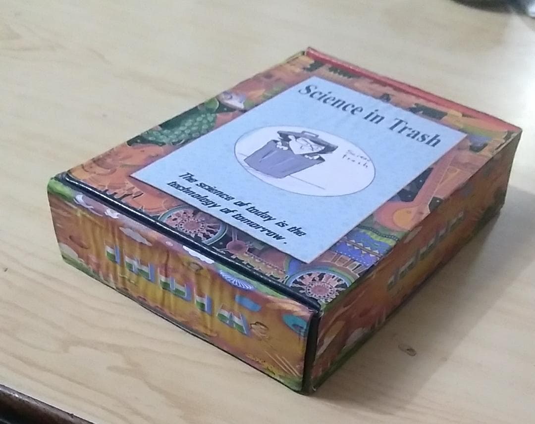 The handmade Science in Trash activity kit in its decorated box.